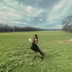 Haley of My Moon Girl Readings standing in a field.
